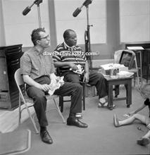 Dave and Louis Armstrong having a bite of lunch during a break in recording of 'The Real Ambassadors', September 1961. 